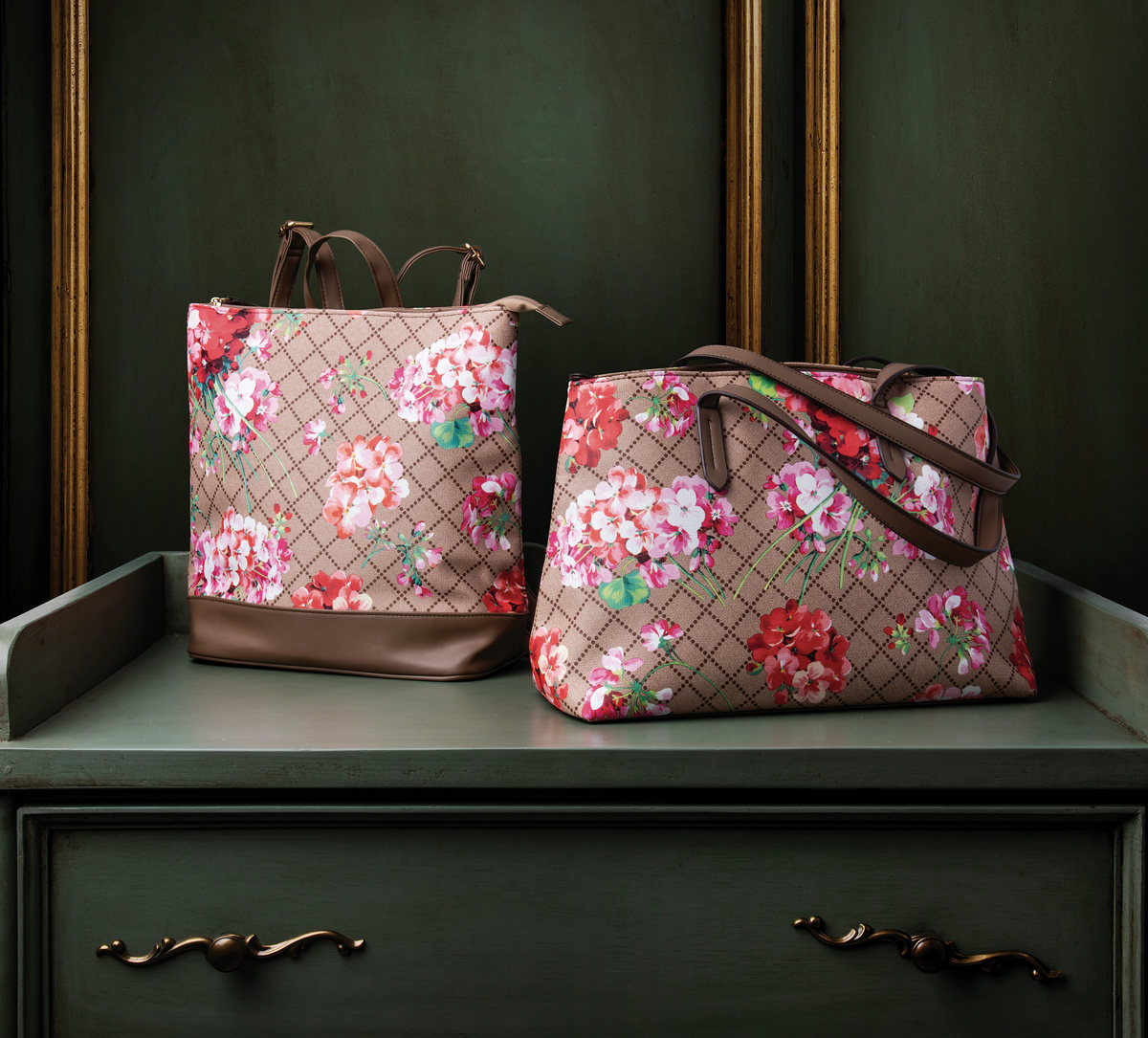 Two floral-print bags on a green dresser