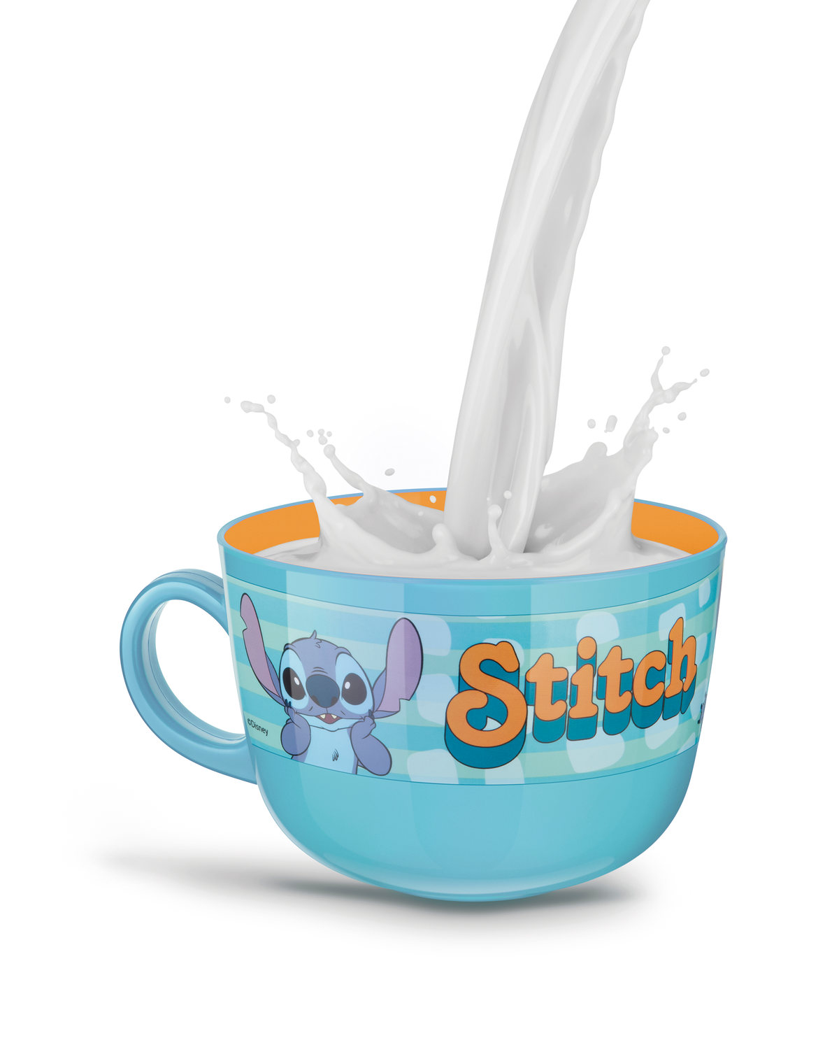 Milk pouring into a Stitch mug with a splash, on white