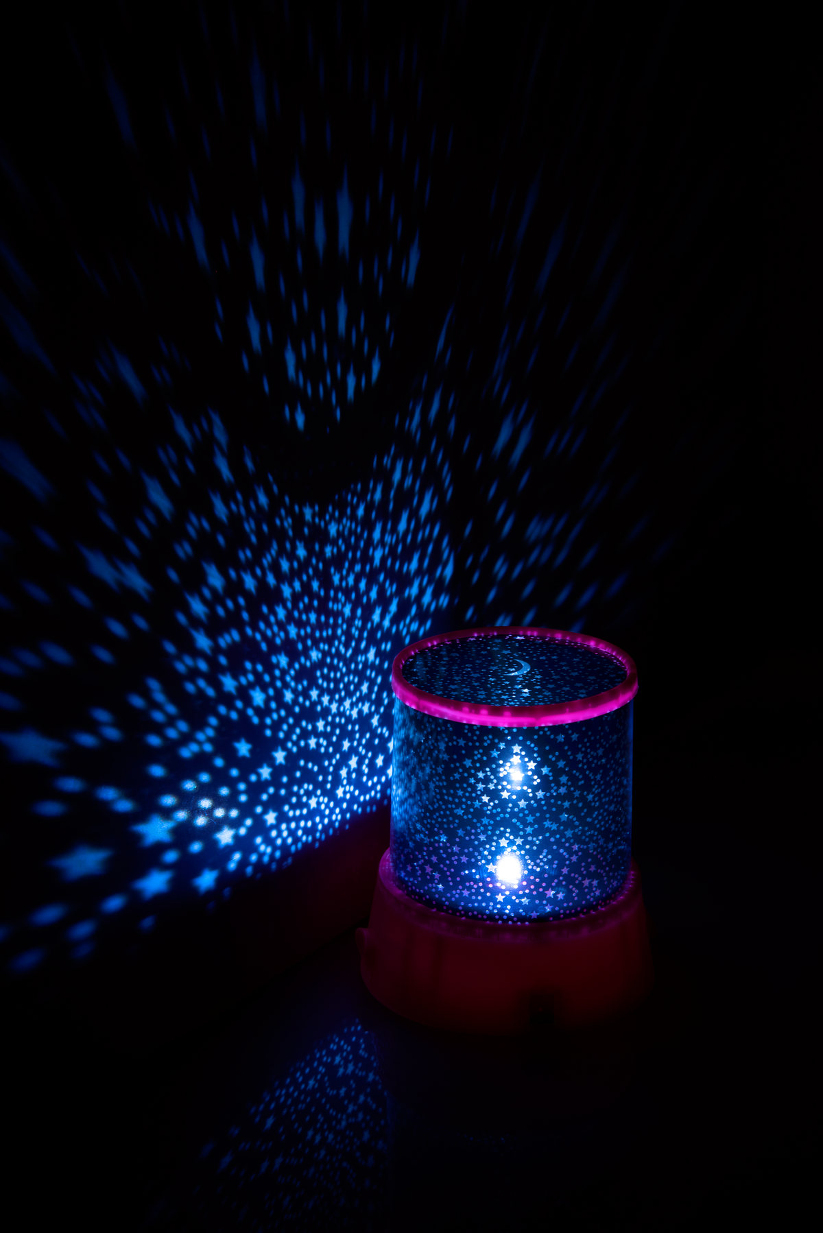 Star projector lamp glowing in the dark