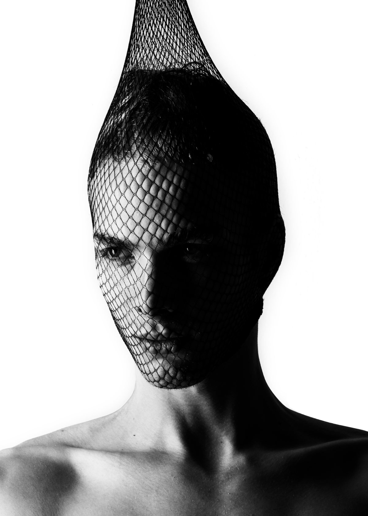 High-contrast black-and-white portrait with a net covering the head