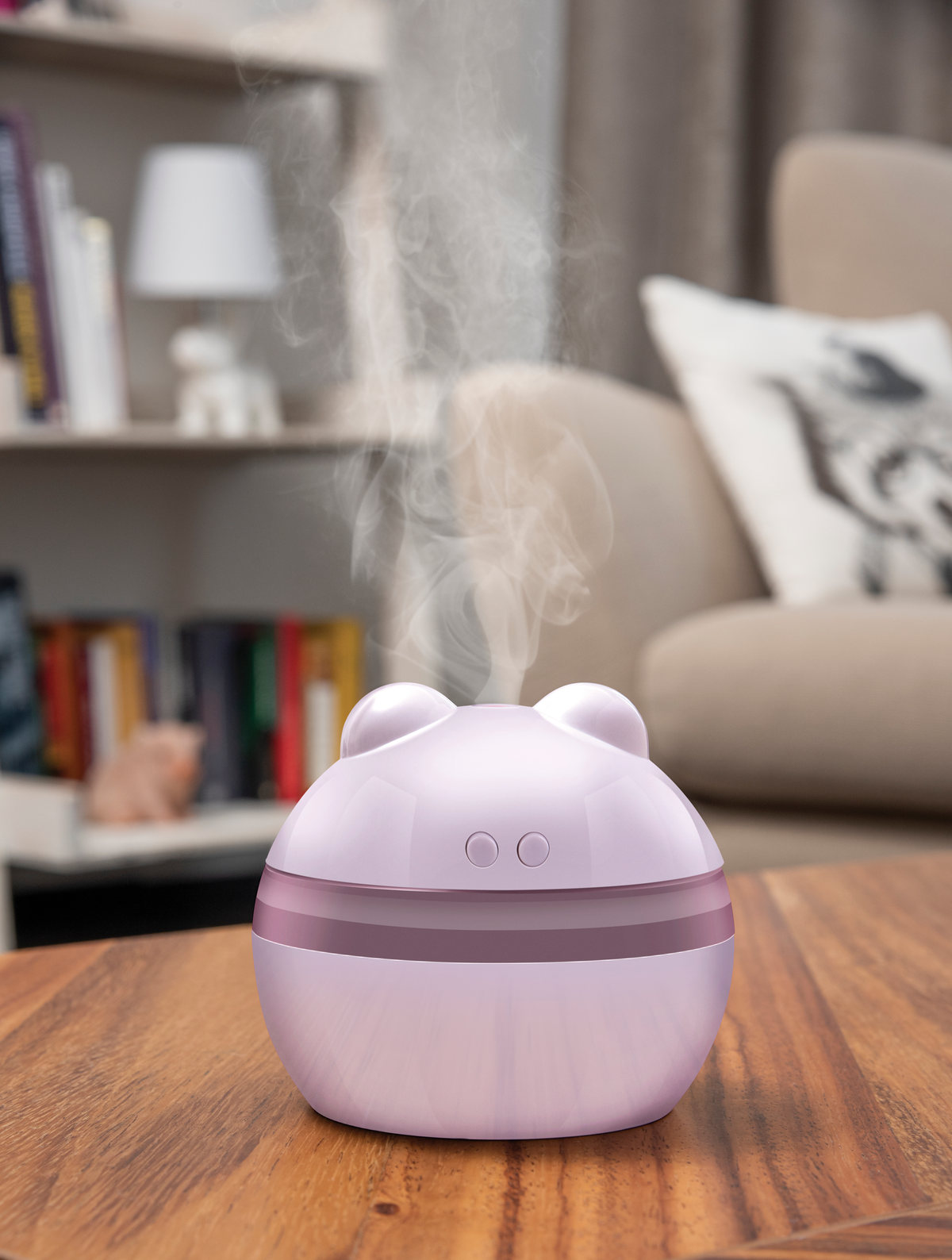 Lilac humidifier on a wooden table in a living room