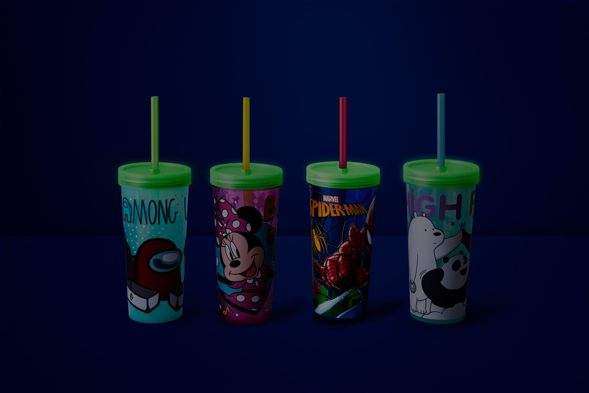 Four character tumblers with straws on dark blue